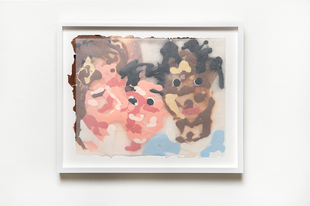 Several abstract pink and brown faces in a white frame.